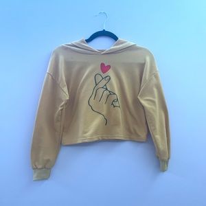 a hooded crop top